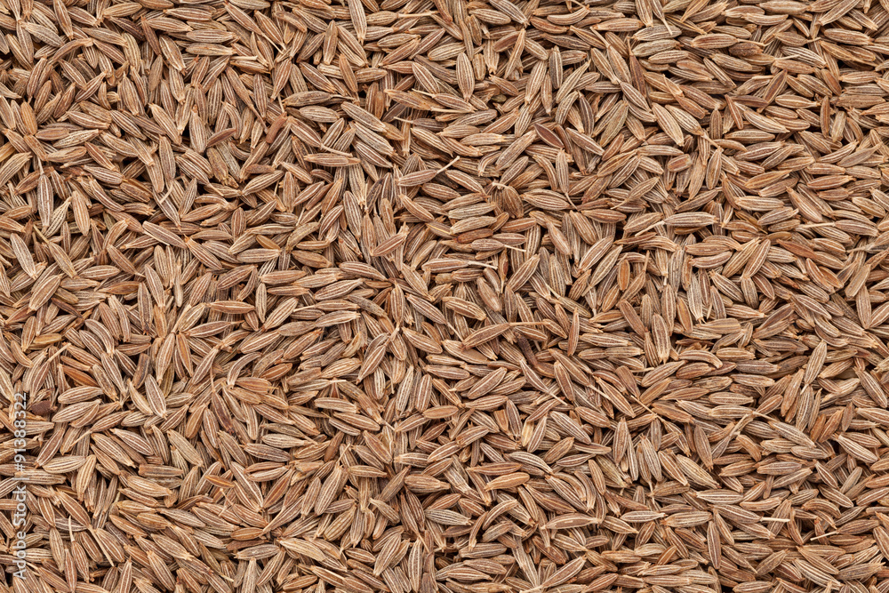 Organic Cumin seed (Cuminum cyminum) closeup background texture. Organic Cumin seed (Cuminum cyminum) closeup background texture.