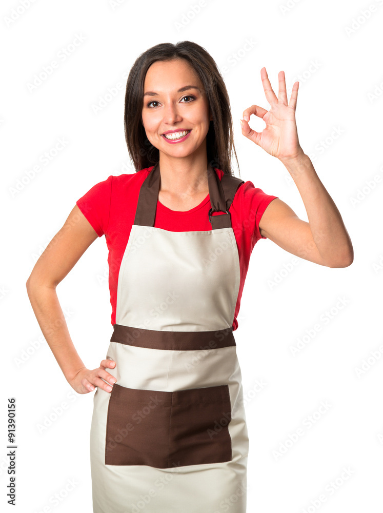 Attractive cook woman showing ok over white background Attractive cook woman showing ok over white background