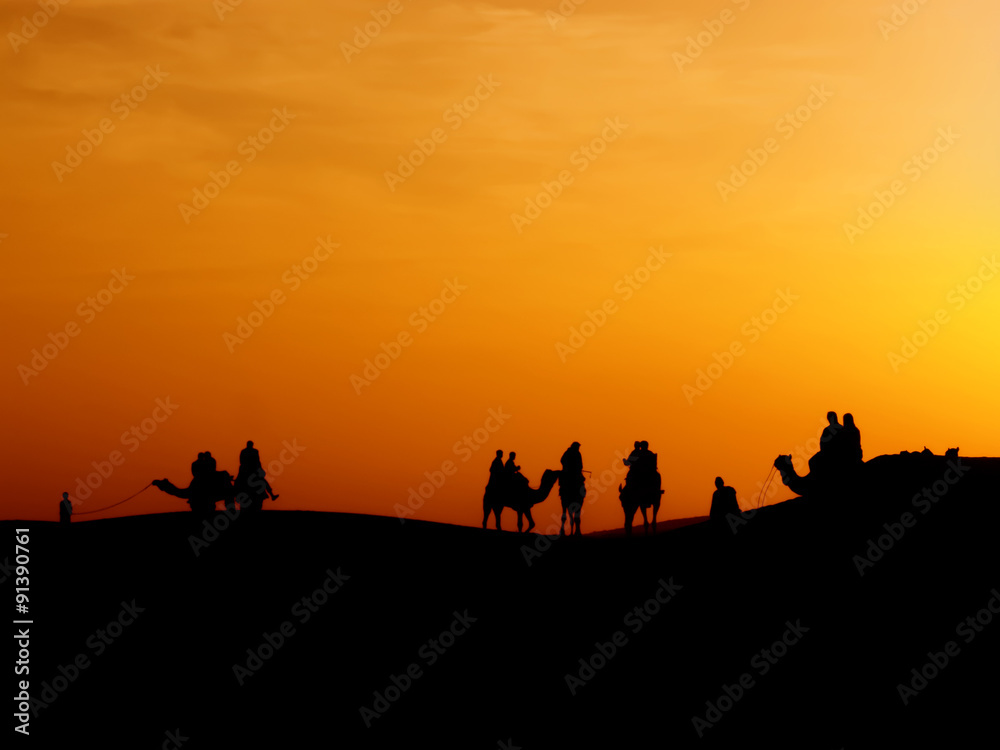 silhouette of traveller who bought safari tour to see sunset at sand dune ,Thar desert,Jaisalmer,India silhouette of traveller who bought safari tour to see sunset at sand dune ,Thar desert,Jaisalmer,India