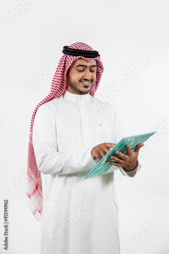 Arab businessman looking at folder. photo