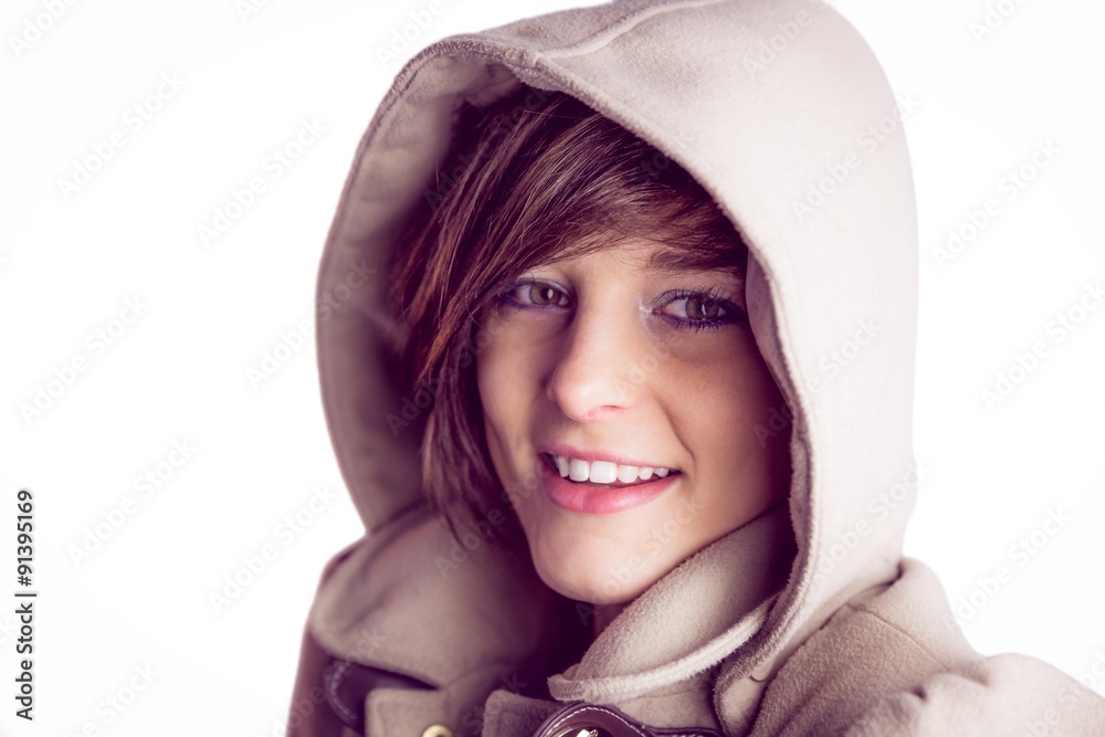 Attractive woman wearing a warm coat with hood raised Attractive woman wearing a warm coat with hood raised