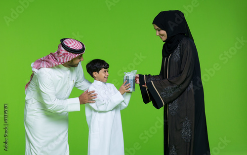 Mother giving gift to her son. photo