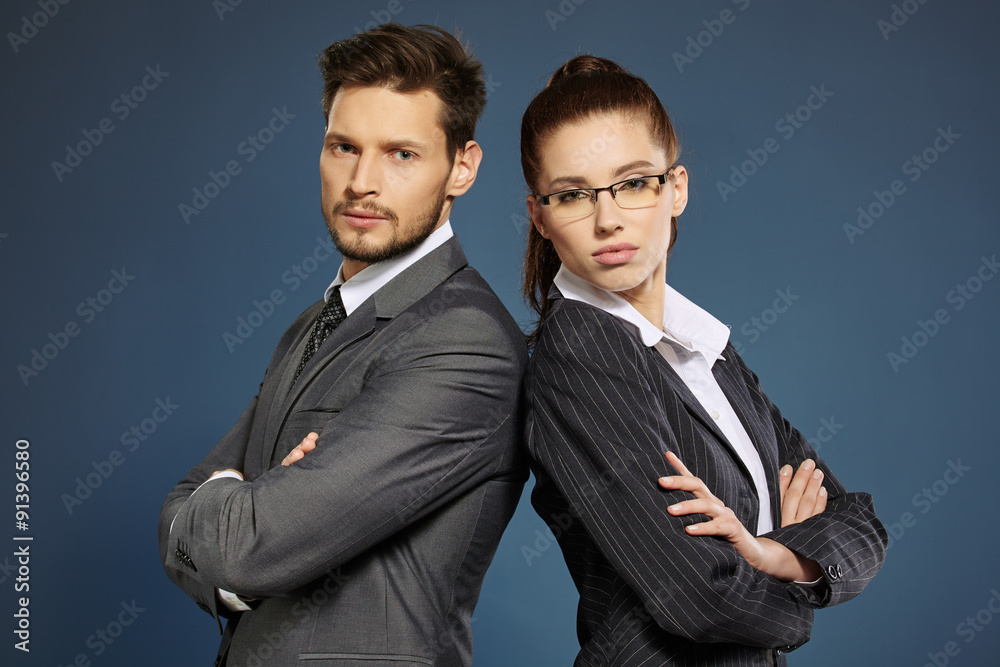 Business couple on grey background Business couple on grey background