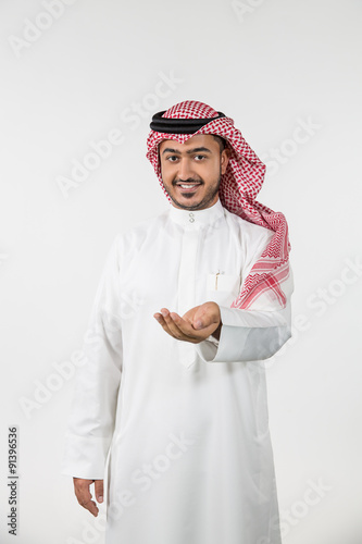 Portrait of Arab man with cupped hand. photo
