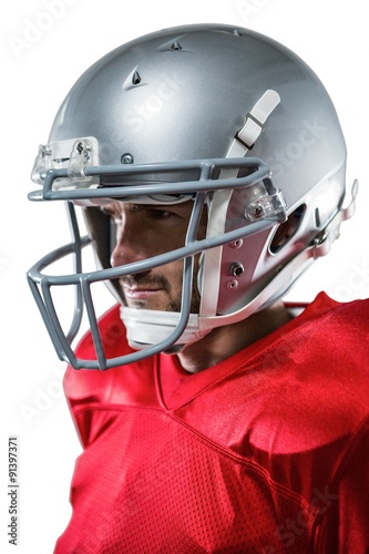 American football player in red jersey looking away