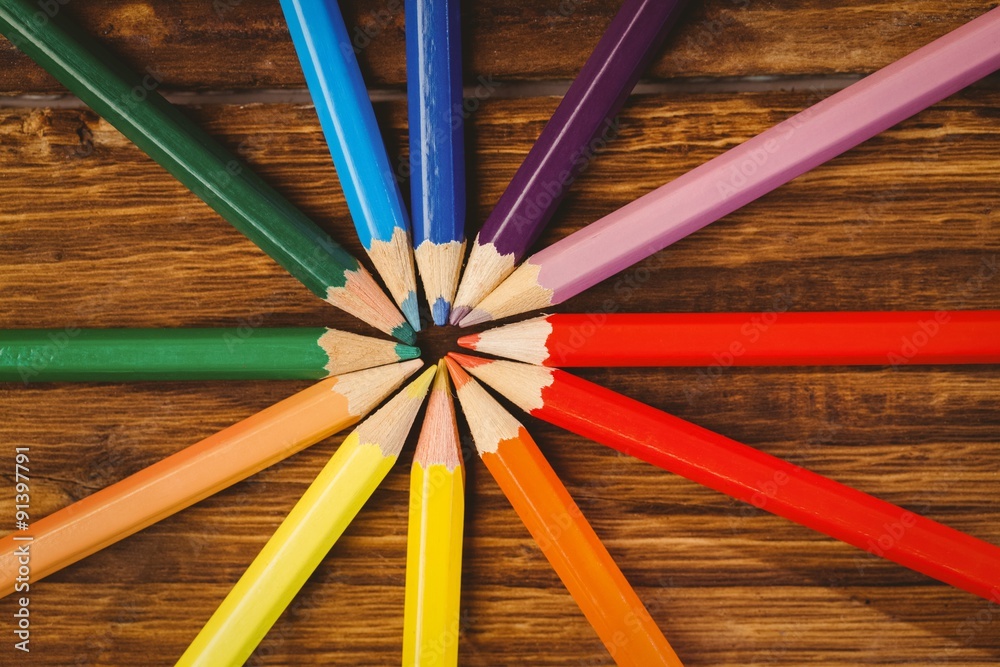 Fototapeta premium Colour pencils on desk in circle shape