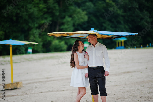 Happy couple having fun on the beach