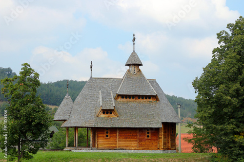 old orthodox wooden church on hill