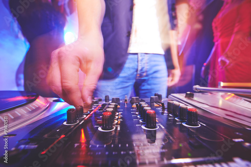 Deejay adjusting sound