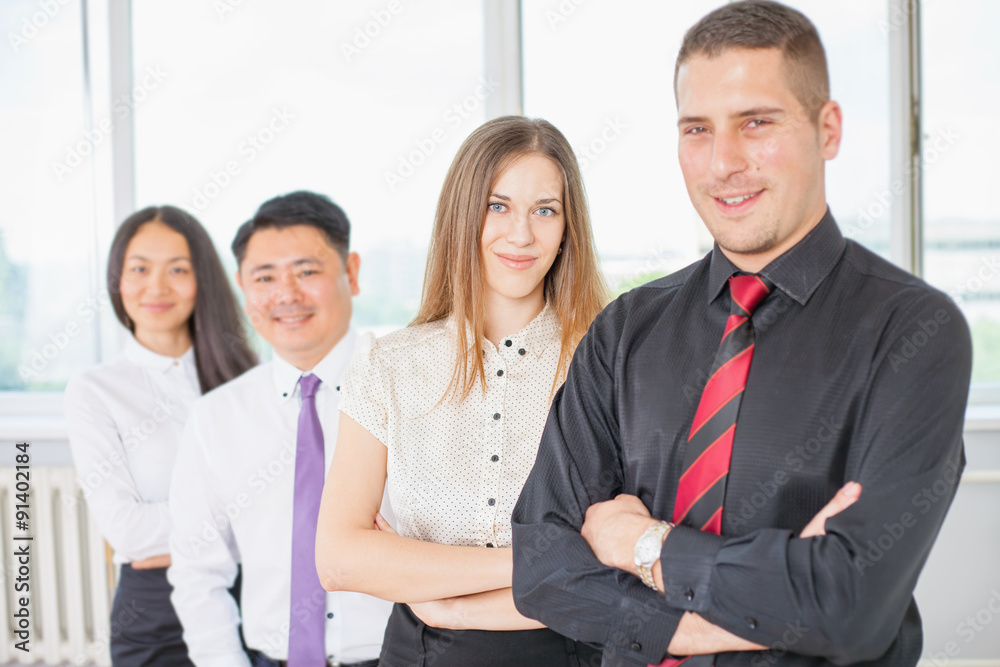 Successful young business man and his business team Successful young business man and his business team