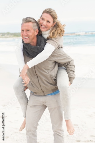 Smiling man giving woman a piggy back © WavebreakmediaMicro