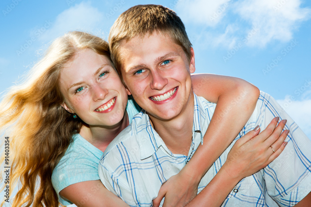 Portrait of a happy couple laughing at camera Portrait of a happy couple laughing at camera
