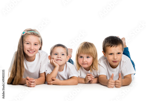 smiling children lying on the floor