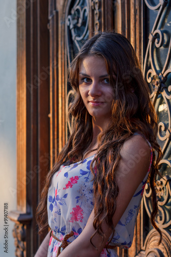 beautiful girl on the background of old houses