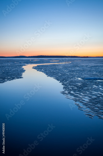 Serene frozen lake scape at twilight