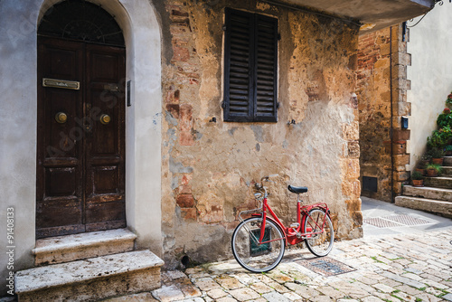 Abandoned bike on the Italian street in the old Tuscany