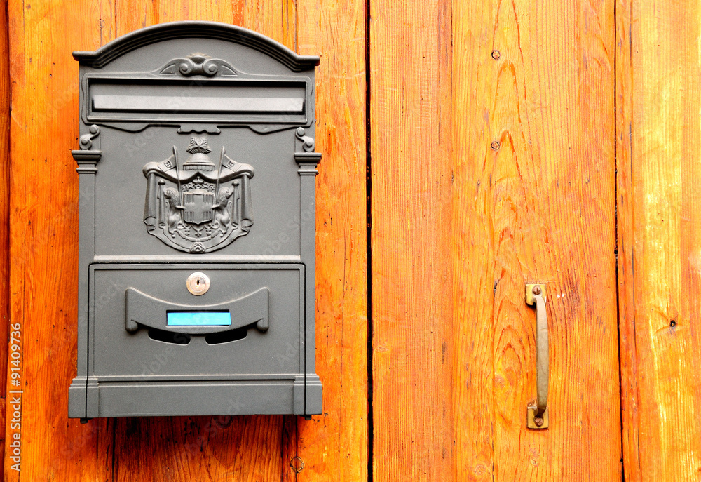 Retro styled post box on wooden door. Verona. Italy. Retro styled post box on wooden door. Verona. Italy.