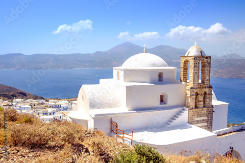 Scenic view of traditional greek cycladic church, village and se
