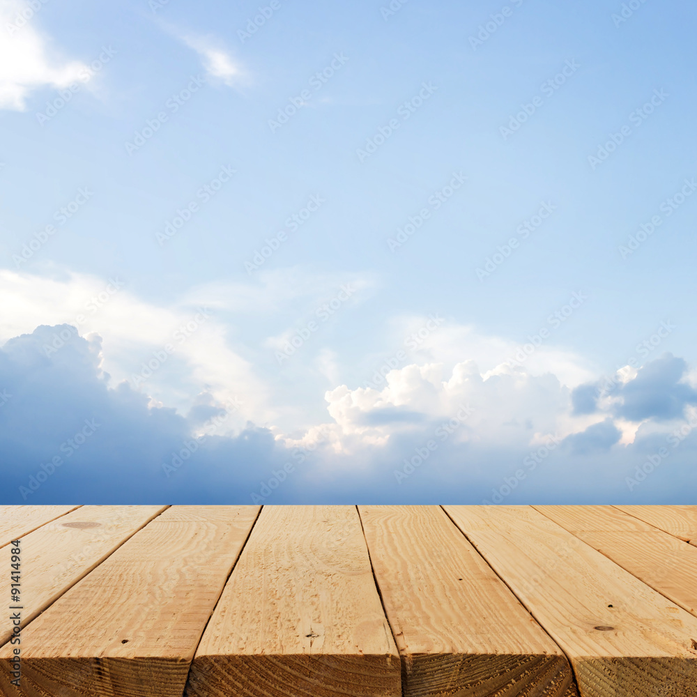 Wooden terrace on blue sky background