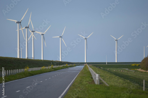 A road with Wind turbines in a row