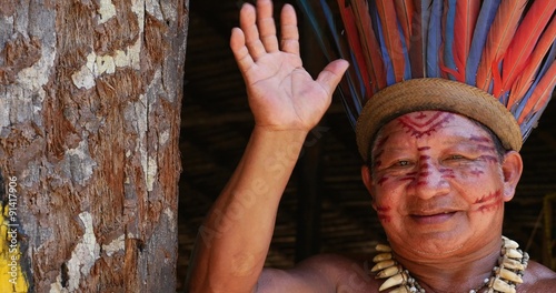 Native Brazilian at an indigenous tribe in the Amazon photo