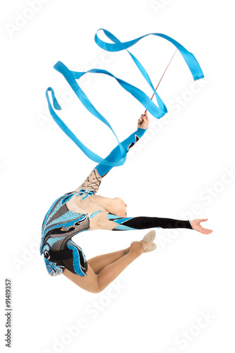 Flexible young gymnast dance with ribbon