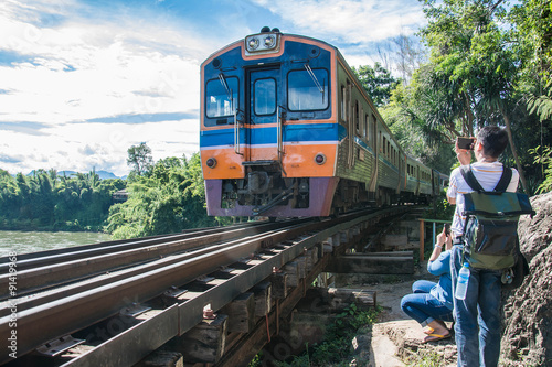 trains running on death railways track crossing kwai river in kanchanaburi thailand this railways important destination of world war II history builted by soldier prisoners