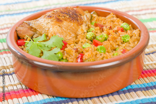 Arroz Con Pollo - Chicken and rice cooked with sofrito and beer.

