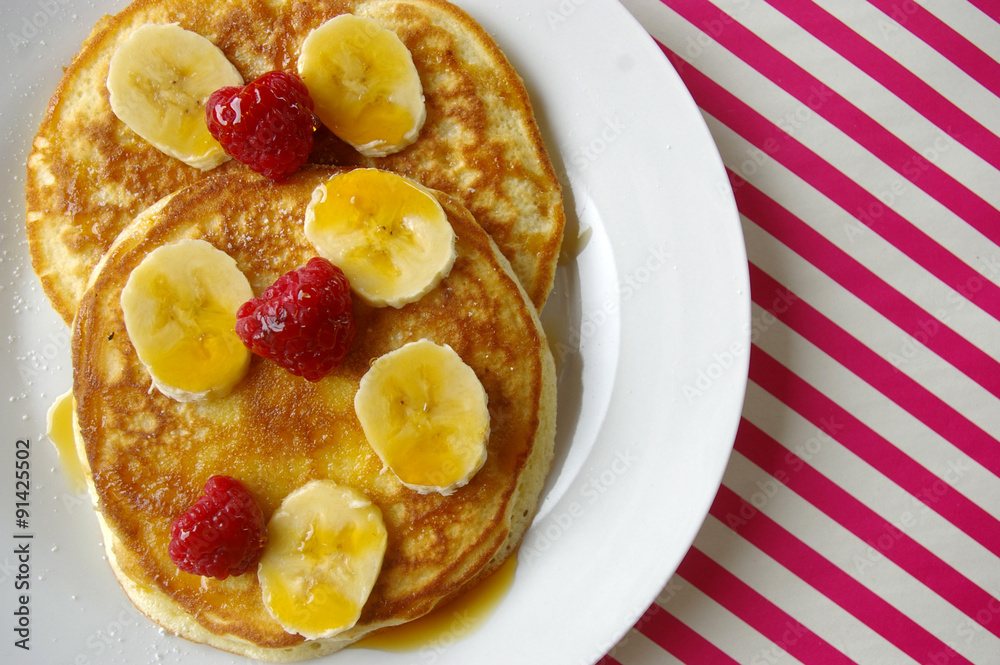 Breakfast crumpets with banana and rasperry Breakfast crumpets with banana and rasperry
