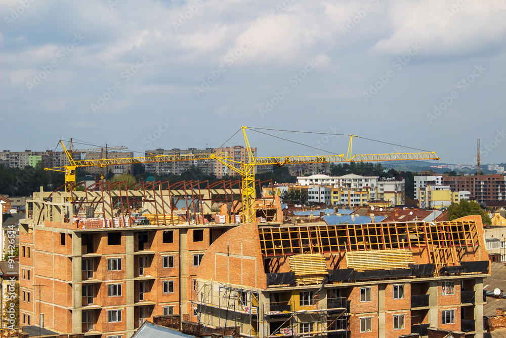 Crane and building construction, aerial view, Lviv.