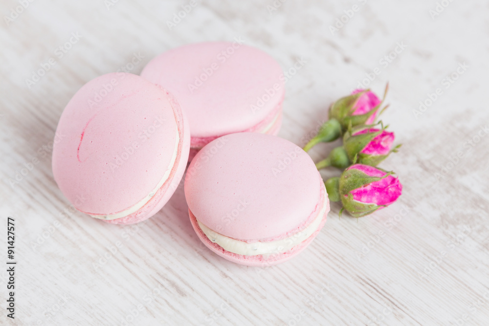 Tender pink macaroons on white wood background Tender pink macaroons on white wood background