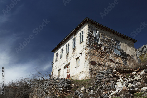 Old stone house on a hill in Lazaropole photo