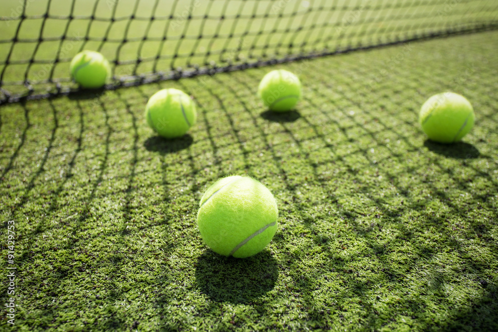 Tennis balls on the court grass