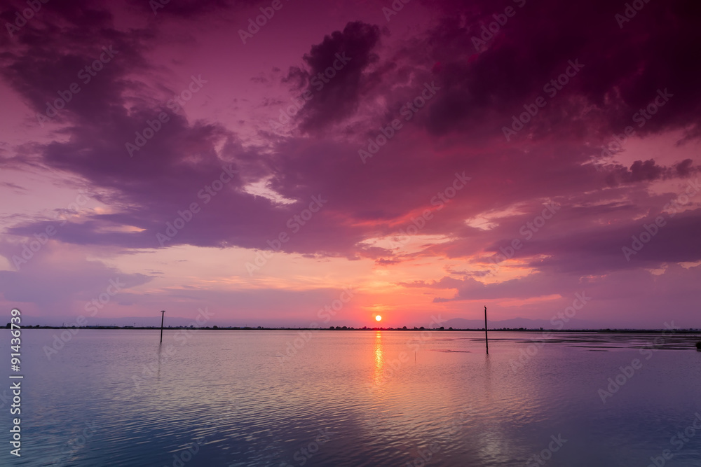 Beautiful sunset with clouds in the sky over ocean