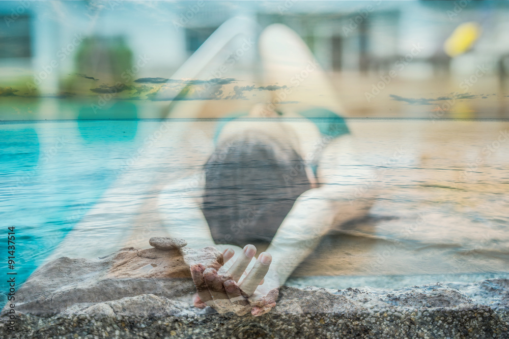 Double exposure Sexy girl relaxing in a pool and sea focus hand