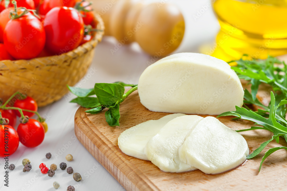 Cooking of salad with mozzarella and tomatoes Cooking of salad with mozzarella and tomatoes