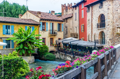 Bilde på lerret Waters and ancient buildings of Italian medieval village