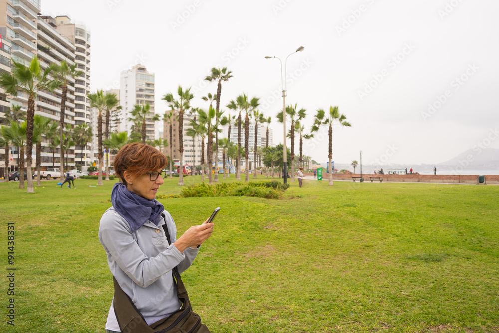 Fototapeta premium Checking smart phone in Lima Miraflores
