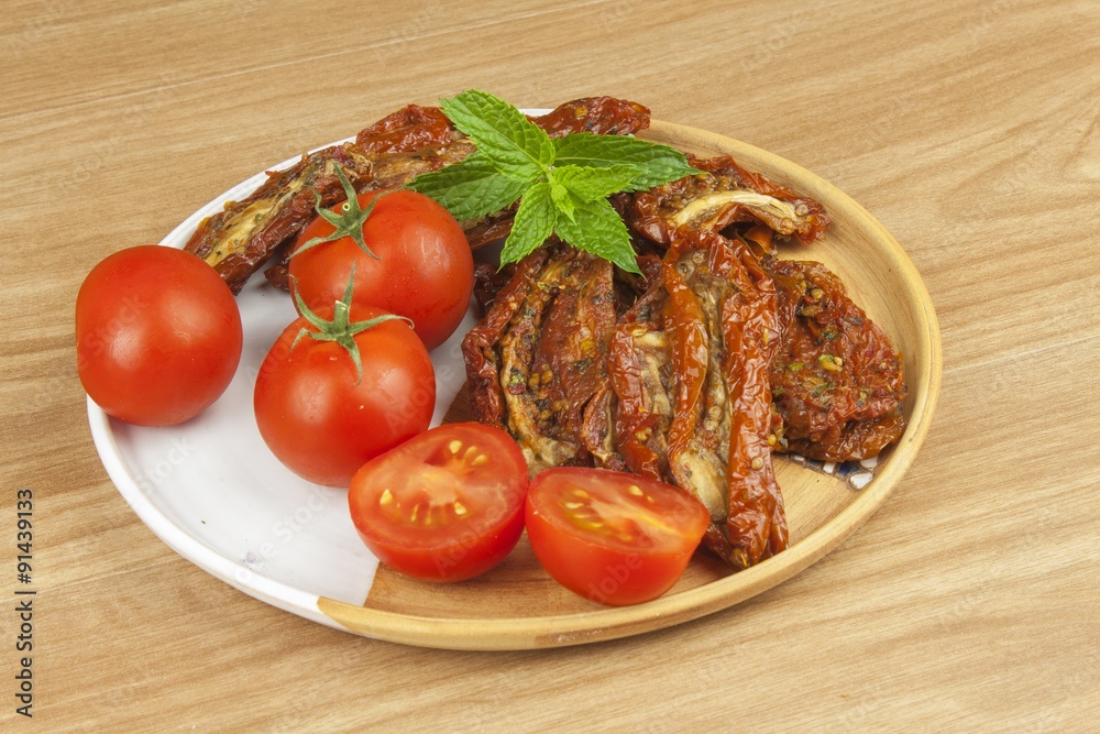 Spicy dried tomatoes marinated in olive oil. Delicious delicacy. Refreshments at the party. Sun-dried tomatoes with olive oil, background. Healthy food.
Spicy dried tomatoes marinated in olive oil. Delicious delicacy. Refreshments at the party. Sun-dried tomatoes with olive oil, background. Healthy food.