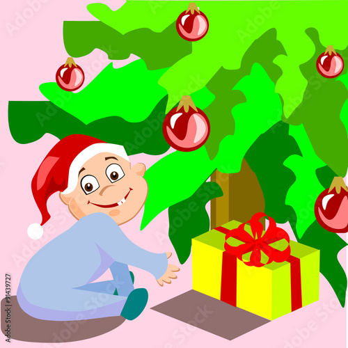 This baby wants to see his Christmas gift