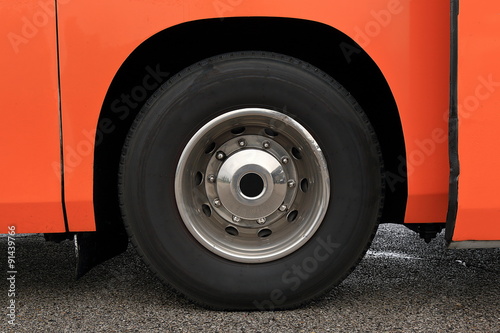 Wheel with damaged rim on a wet road