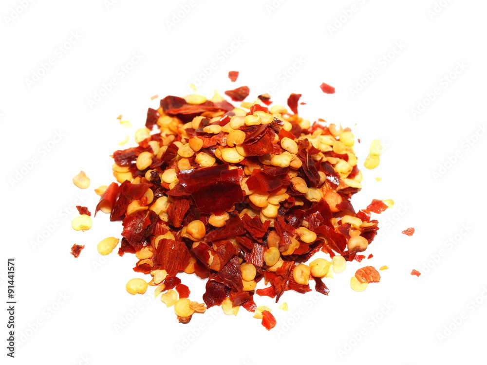 pile crushed red pepper, dried chili flakes and seeds isolated on white background pile crushed red pepper, dried chili flakes and seeds isolated on white background
