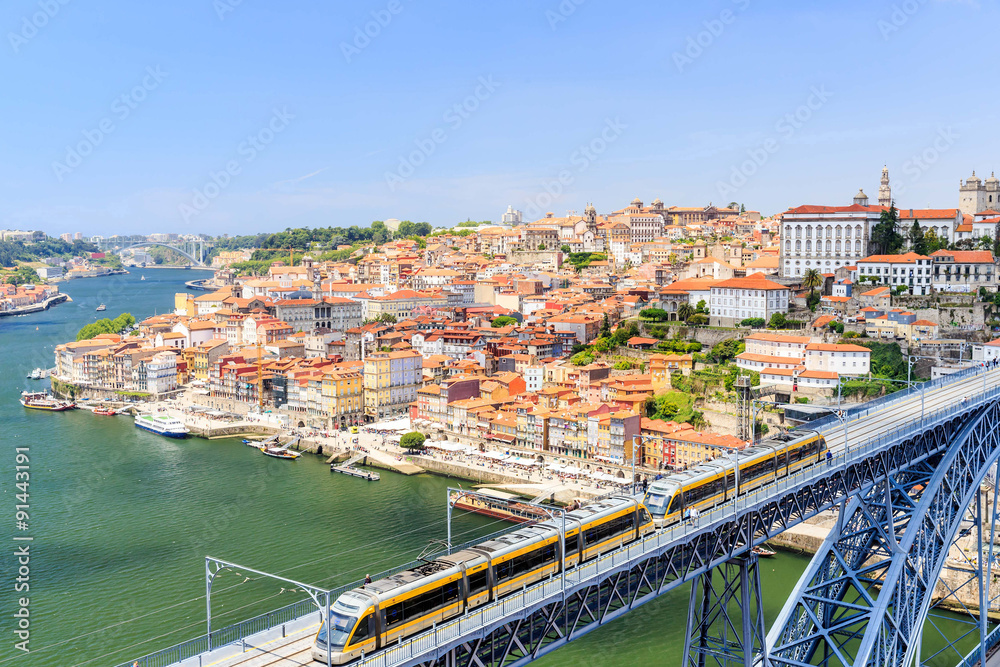 Porto with the Dom Luiz bridge. A metro train can be seen on the