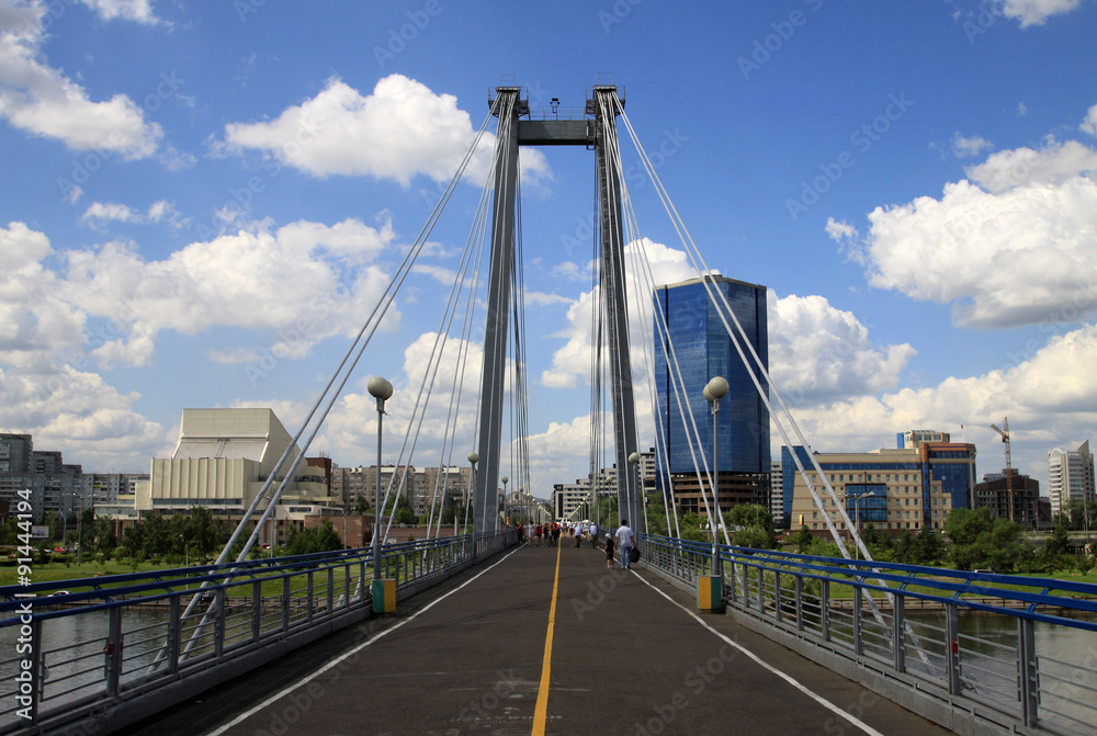 KRASNOYARSK, RUSSIA - JULY 16, 2013:  Pedestrian bridge over the Yenisei to the Tatyshev Island