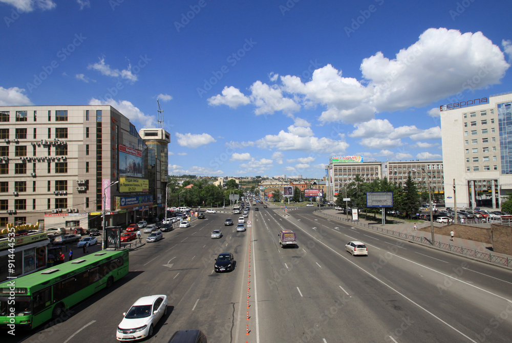 KRASNOYARSK, RUSSIA - JULY 16, 2013: View of Veinbaum street from a pedestrian bridge