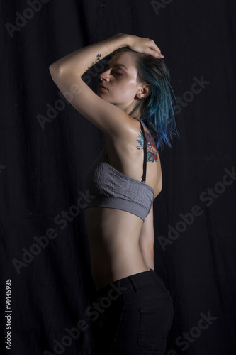 Blue haired girl pose in studio