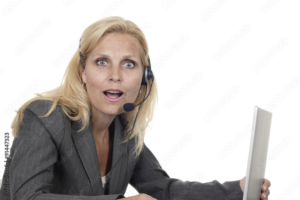 Woman with Headset and Computer Surprised Looking at Camera Woman with Headset and Computer Surprised Looking at Camera