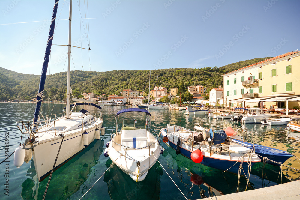 Cres Island, Croatia: View to the village Valun with jetty and boats Cres Island, Croatia: View to the village Valun with jetty and boats