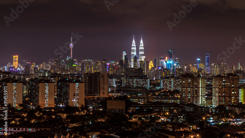 KUALA LUMPUR, MALAYSIA - 30TH AUGUST 2014; Kuala Lumpur, the capital of Malaysia, or KL by locals. Its modern skyline is dominated by the 451m-tall KLCC, a pair of glass-and-steel-clad skyscrapers.