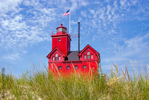 red lighthouse in dune grass in Holland, Michigan